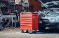 Red tool box in a garage. Royalty Free Stock Photo