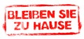 Red stencil frame: Stay at Home in german language banner Royalty Free Stock Photo