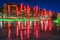 Red sticks on Grand Canal Square in docklands at rain, night, Dublin, Ireland Royalty Free Stock Photo