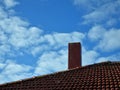 Red Stone Chimney Red Tiled Rood Blue Cloudy Sky Royalty Free Stock Photo