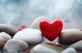 Red stone heart on grey stones Royalty Free Stock Photo