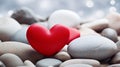 Red stone heart on grey stones Royalty Free Stock Photo