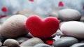 Red stone heart on grey stones Royalty Free Stock Photo