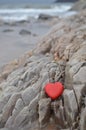 Red Stone Heart on Rocky Shore Royalty Free Stock Photo