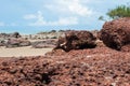 the red stone and rock on the sand beach in clear blue sky and n Royalty Free Stock Photo