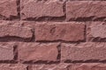 Red stone wall background. The texture of the decorative stone. Close-up Royalty Free Stock Photo