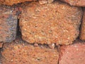 red stone wall of porous volcanic bricks rough surface texture