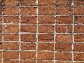 Red stone wall stacked up grout with grey cement Rock porous rough surface material texture background Royalty Free Stock Photo