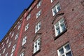 Red stone white windows building house in streets of Helsinki european city Royalty Free Stock Photo