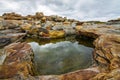 Red stones beach. Rybachy Peninsula. Royalty Free Stock Photo