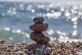 Red stones and pebbles stack, harmony and balance, one stone cairn on seacoast Royalty Free Stock Photo