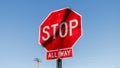 Red STOP ALL WAY road sign at the side of the road Royalty Free Stock Photo