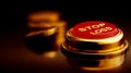 Red Stop Loss Button With Gold Coins Symbolizing Financial Risk Royalty Free Stock Photo