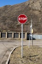 Red stop road sign at the corner of an intersection. Royalty Free Stock Photo