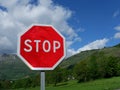 Red stop sign in nature mountain landscape road in France Royalty Free Stock Photo