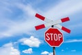 Red stop sign with railway cross sign and blue sky Royalty Free Stock Photo