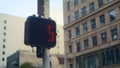 Red stopsignal hand up on crosswalk city close up. Regulation signal on pole