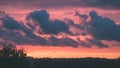 red storm clouds over meadow with green grass - vintage effect Royalty Free Stock Photo