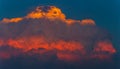 Red storm cumulonimbus clouds at sunset light