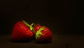 Red strawberries close view on black background Royalty Free Stock Photo