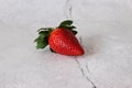 Red strawberries on a light stone table