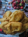 Red strawberries and sorrel pies on the kitchen table in Kamen-na-Obi, Altai, Russia. Vertical