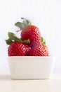 Red strawberries in a square bowl Royalty Free Stock Photo