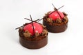 Red strawberry dessert with dark chocolate jelly caviar and chocolate border