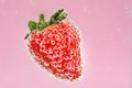 Red strawberry fruit floating in the water on pink background. High value commercial food photography. Fresh beverage in menu.