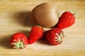 Strawberry and kiwi on chopping board