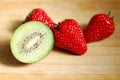 Strawberry and kiwi on chopping board