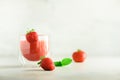 Red strawberry milkshake in glass on grey background with copy space. Summer food concept, vegan diet. Pink smoothie Royalty Free Stock Photo