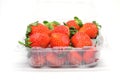 Red strawberry ripe sweet fruit in plastic box packaging Royalty Free Stock Photo