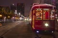 New Orleans streetcars on Canal Street at night