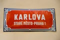 Red street sign in Prague, Czech Republic with white text: Karlova street, Old Town, Prague 1. Orientation signs, city center. Royalty Free Stock Photo