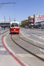 Red streetcar at fisherman`s wharf in retro style on the way to market street downtown San Francisco, harbor area