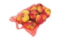 Red string bag of bright apples isolated