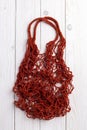 Red string shopping bag, or net bag, or mesh bag. Royalty Free Stock Photo