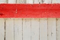 Red stripe against white boards