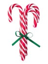 Red striped caramel sticks tied with a green bow