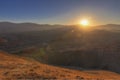 Red striped mountains at sunset day