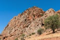 Red structural rock against the blue sky in the mountains of Armenia. Royalty Free Stock Photo