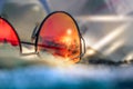 Sunglasses with reflection of summer beach with black sand, sun and sea. Capri Italy Royalty Free Stock Photo