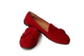 Red suede woman`s moccasins shoes isolated on white