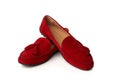 Red suede woman`s moccasins shoes isolated on white