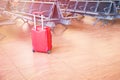 Suitcase at the airport waiting area Royalty Free Stock Photo