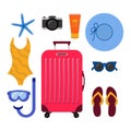 Red suitcase and beach accessories around. Summer travelling concept. Flip flops, snorkeling mask, sunglasses, swimsuit, sun cream Royalty Free Stock Photo