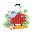 Red Suitcase on the beach. Travel bag with hat on the sunny beach. Flipflop, ball and palm leaves. Summer holidays Royalty Free Stock Photo