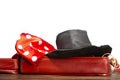 A red suitcase with a magician\'s hat and a red cloth on a white background Royalty Free Stock Photo