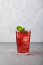 Red summer non-alcoholic refreshing drink with ice or fruit iced tea, close-up Royalty Free Stock Photo